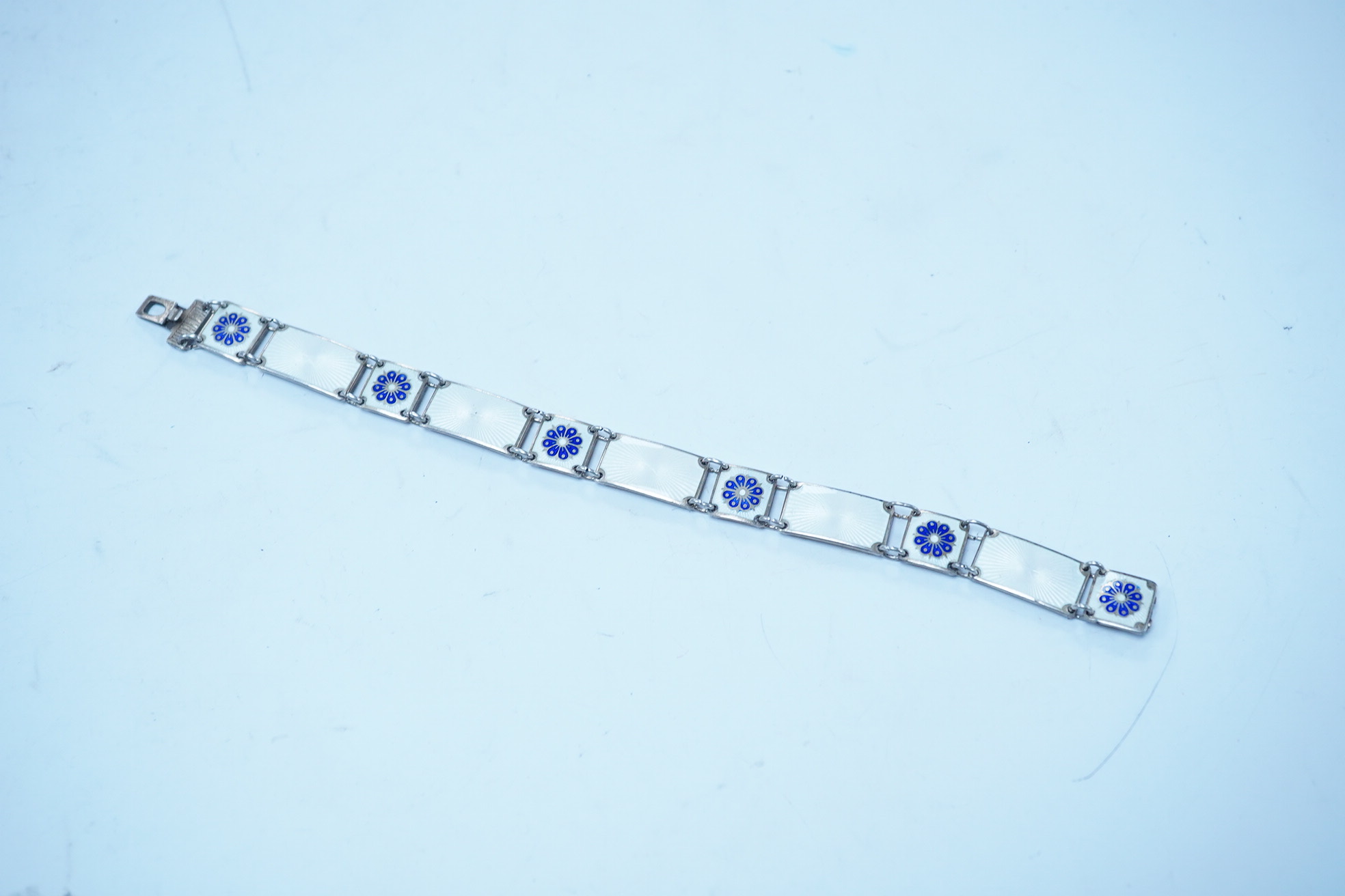 A Norwegian sterling and enamel bracelet, by David Andersen, 18.6cm. Condition - fair to good